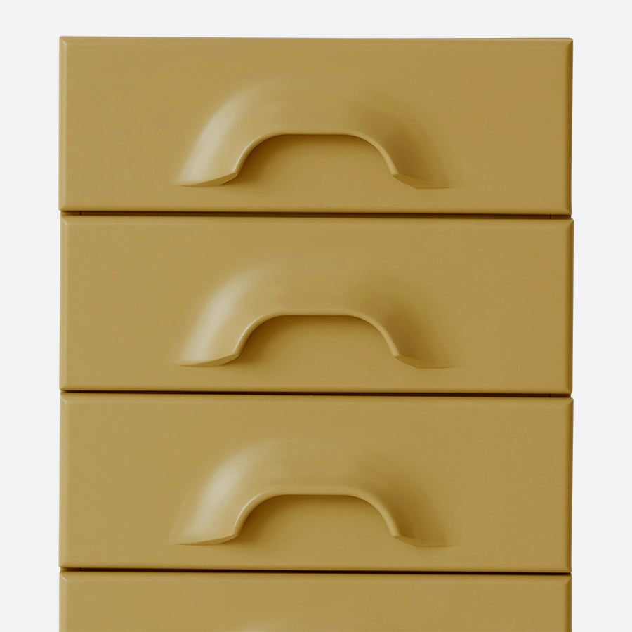 detail of sage green cabinet with 6 drawers