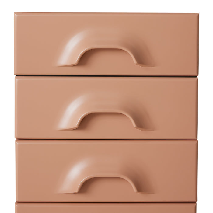 detail of blush colored chest with 7 drawers