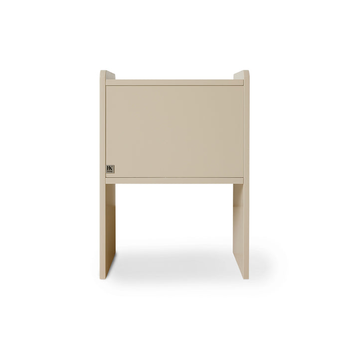 backside of a cream colored nightstand