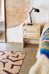 retro look nightstand in cream color with two drawers in bedroom