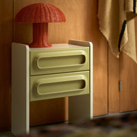 retro style nightstand with 2 drawers in sage green with cream and coral rattan mushroom lamp