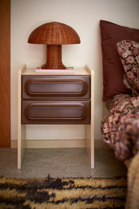 retro nightstand brown and cream with rattan mushroom lamp in bedroom