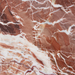 detail of red brown marble table block