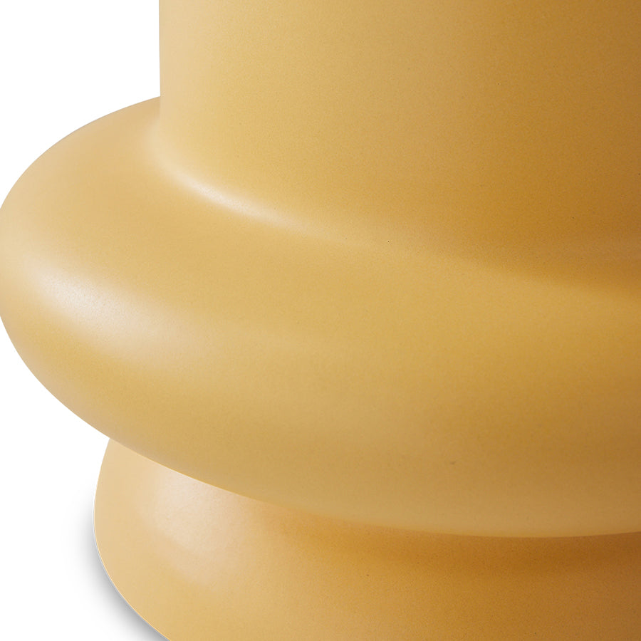 detail of honey yellow curved earthenware accent table