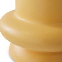 detail of honey yellow curved earthenware accent table