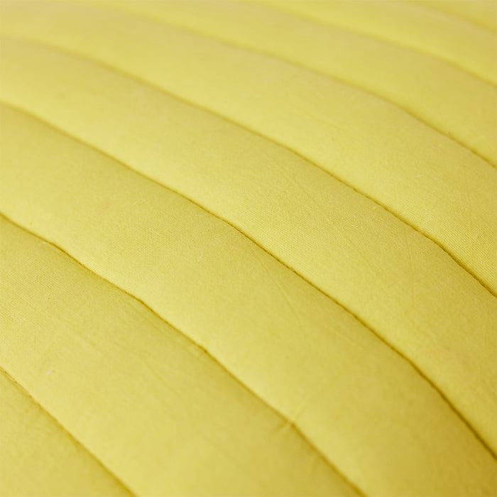 detail of quilted throw pillow bright yellow