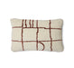 brown and off white woolen lumbar pillow with graphic design