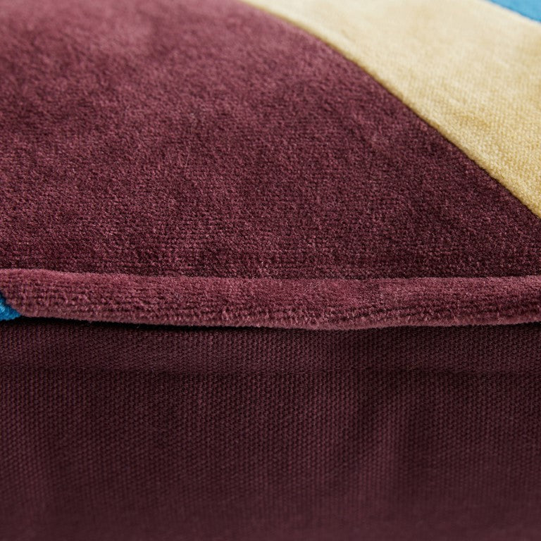detail of maroon, blue and yellow striped velvet lumbar pillow