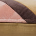 detail of striped velvet lumbar pillow in caramel and pink tones