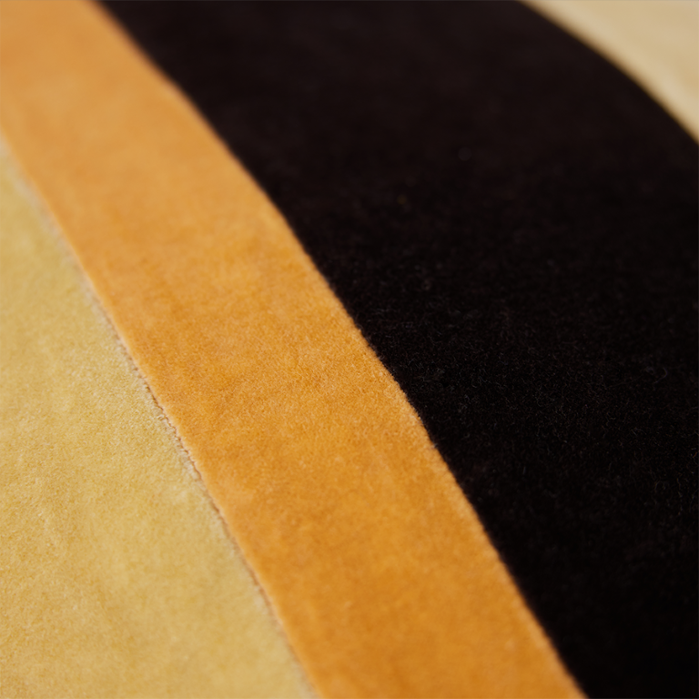 detail of yellow orange and black velvet lumbar pillow