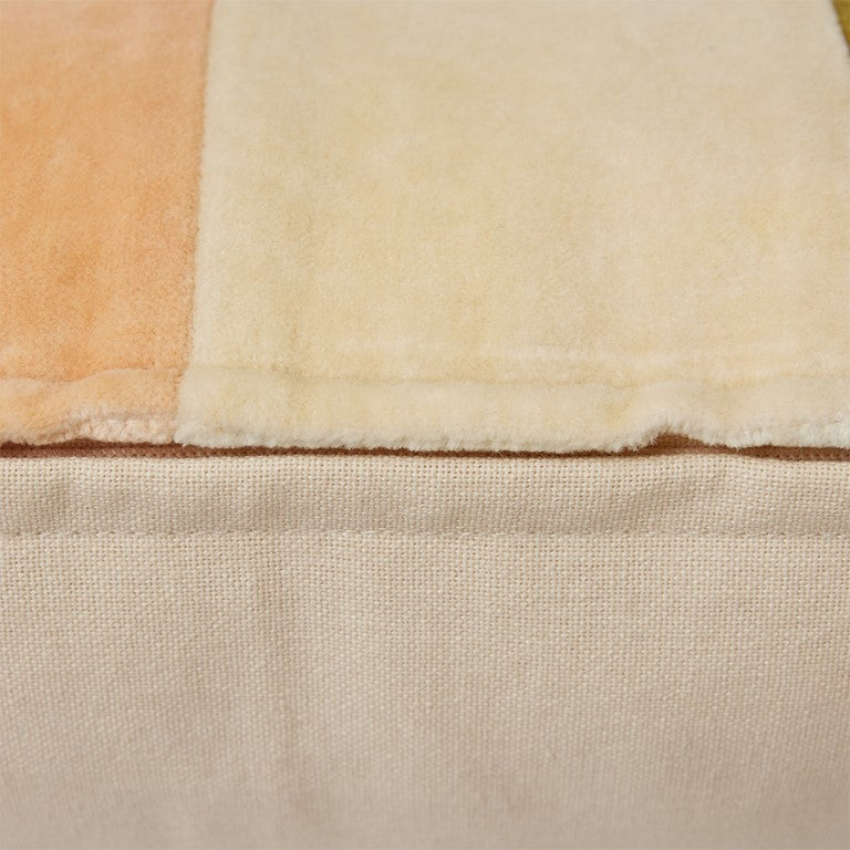 detail of green each and cream striped velvet lumbar pillow