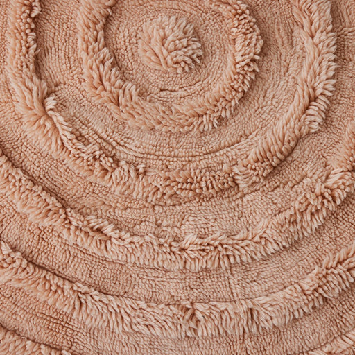 round soft pink colored woolen rug