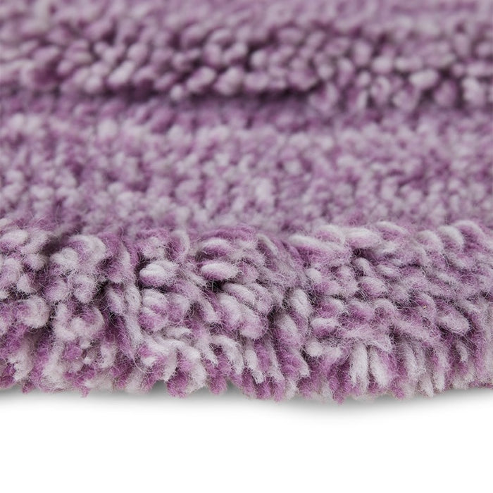detail of round lilac rug with high and low piles