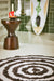 round high and low pile black and white bathmat in bathroom 