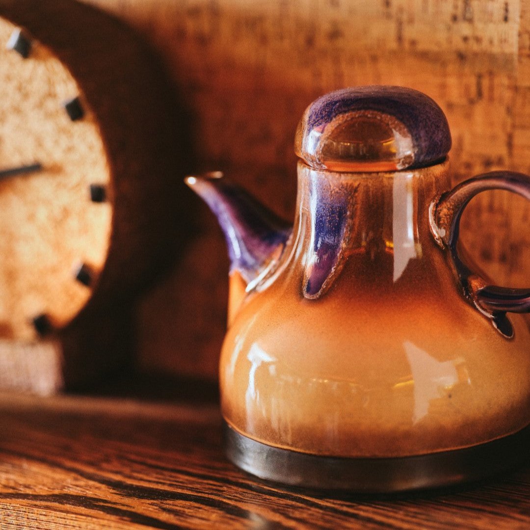 retro style coffee pot with blue, orange and brown reactive glaze finish