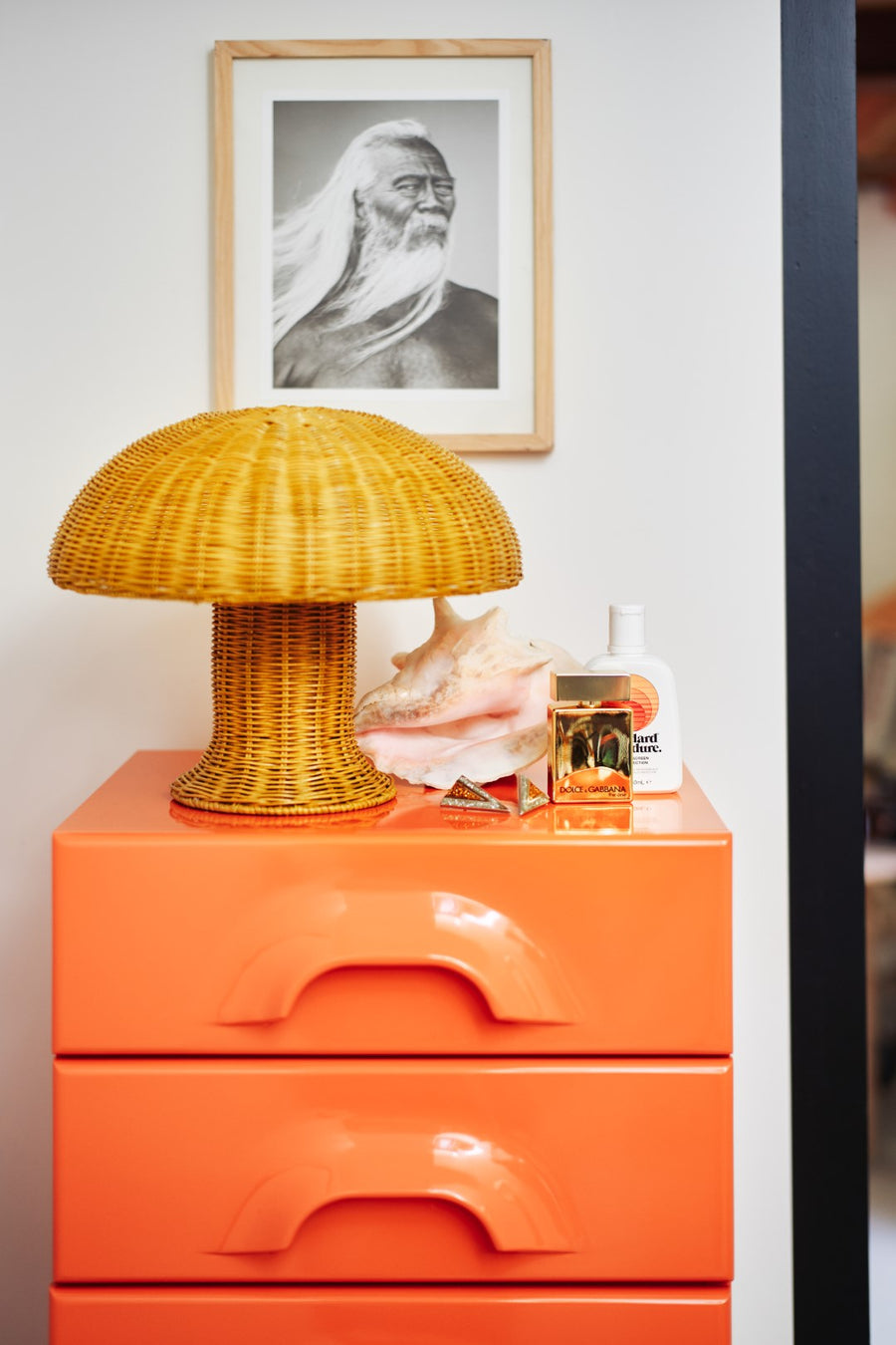 yellow wicker mushroom lamp on orange drawer