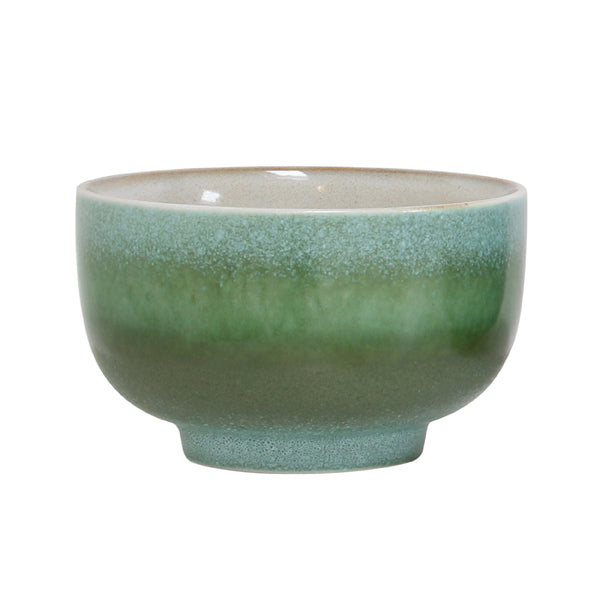 Green ceramic bowl on a white background