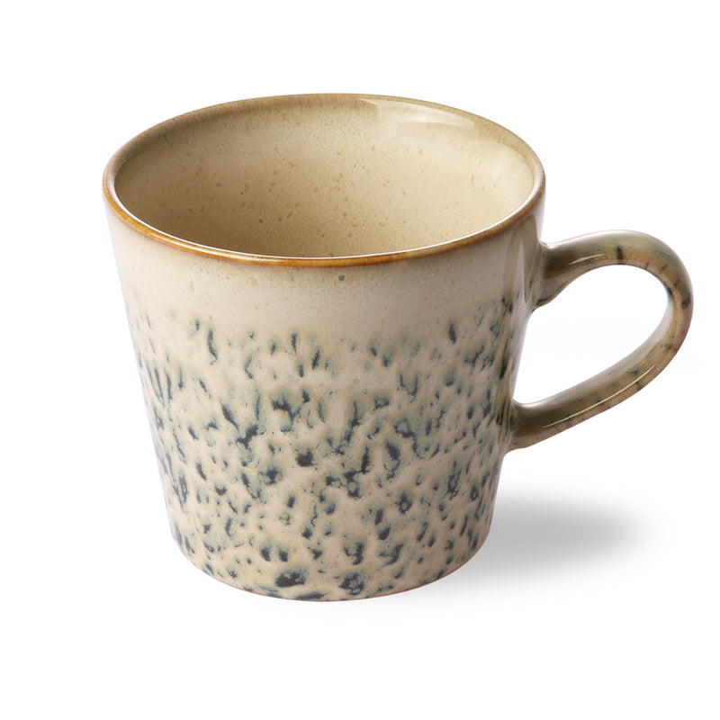 Speckled ceramic mug on a white background