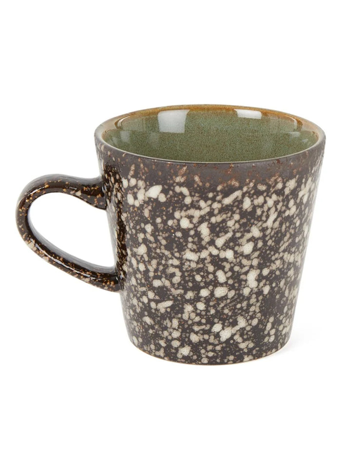 Speckled ceramic mug on a white background