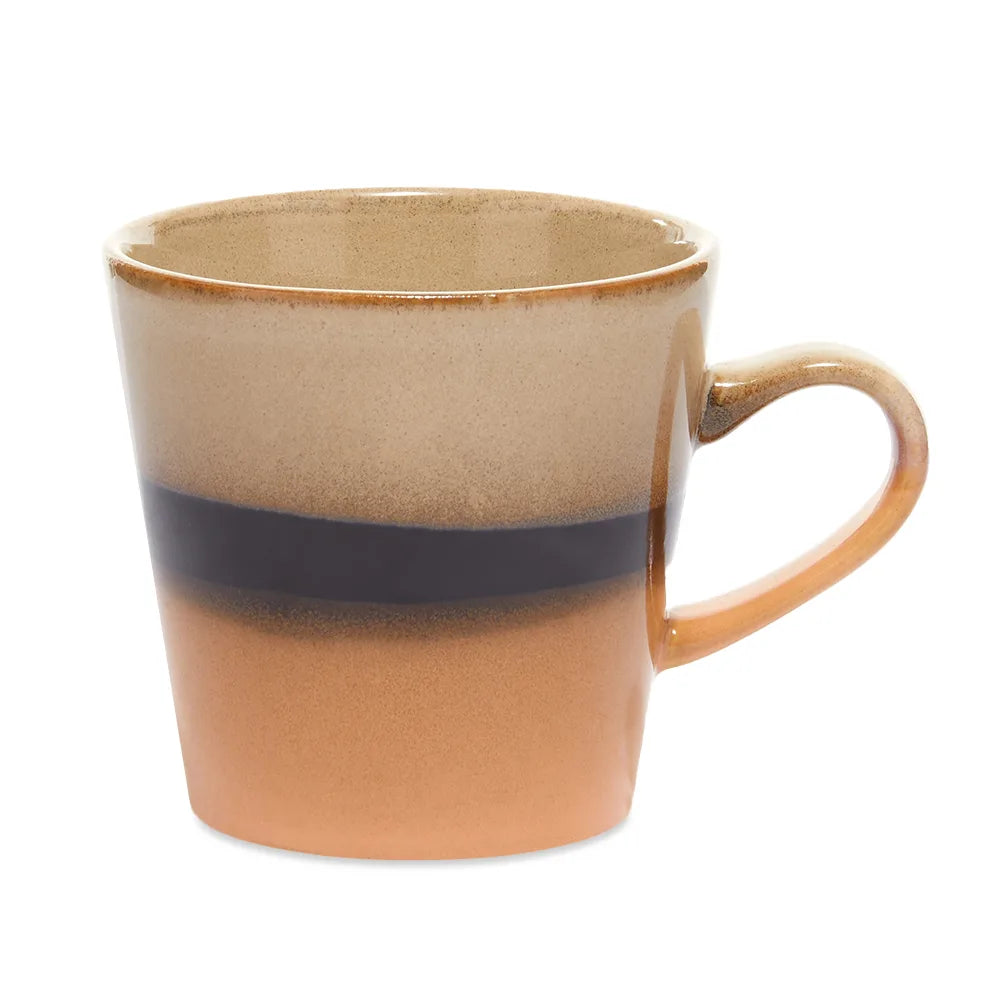 Ceramic mug with a two-tone design on a white background