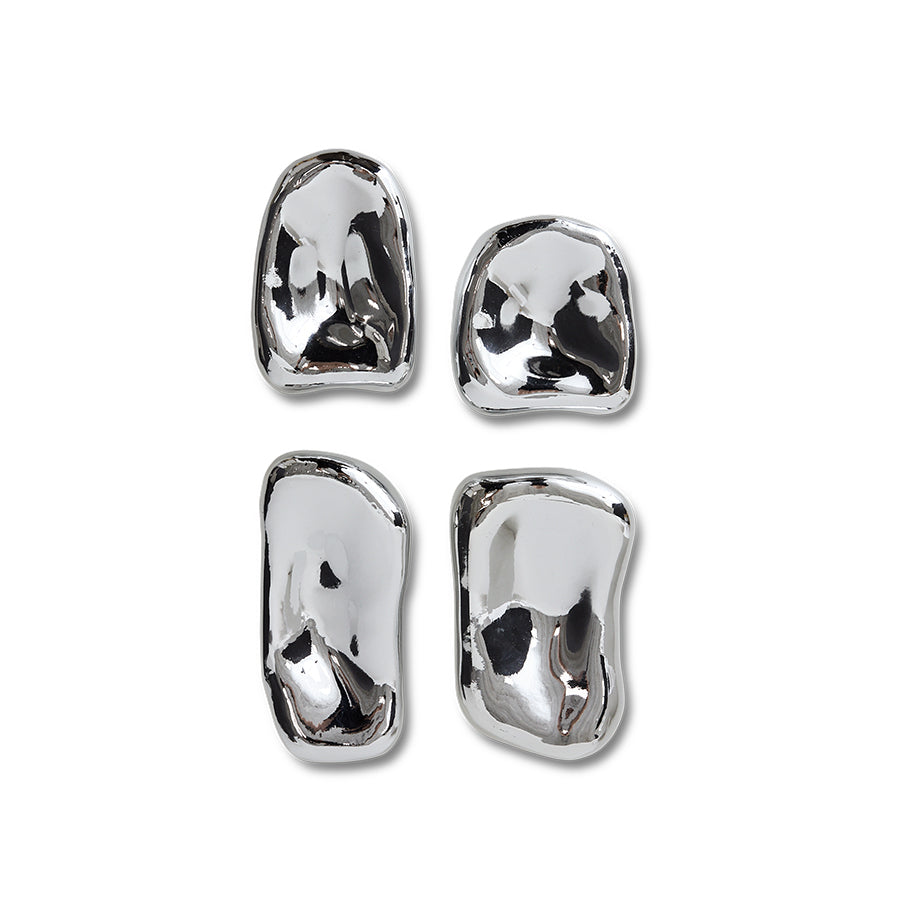 Set of four silver sculptures on a white background