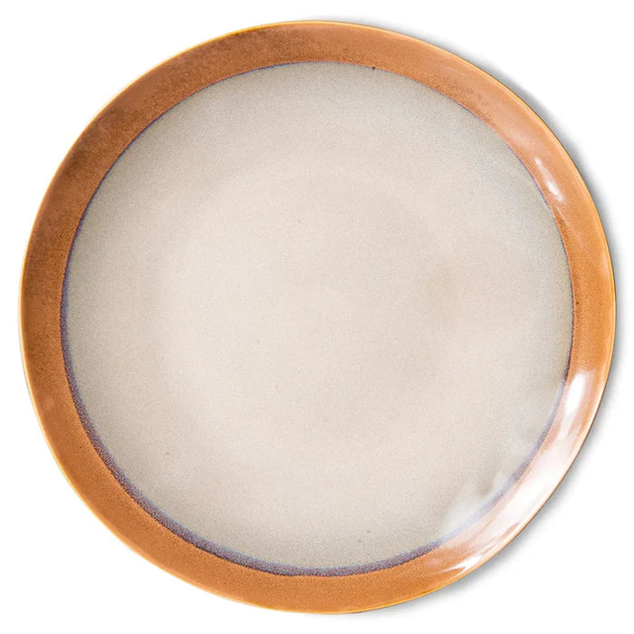 Round ceramic plate with a brown rim on a white background