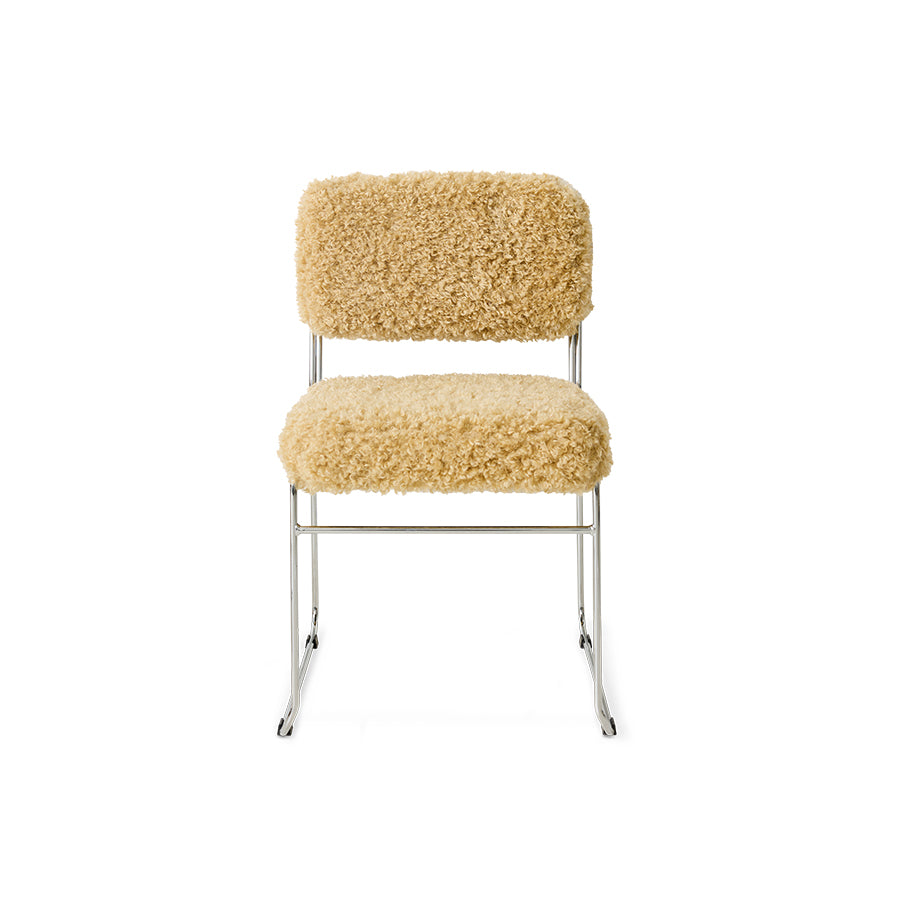 Chair with beige boucle upholstery on a white background