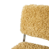 Close-up of a textured beige chair with a white background