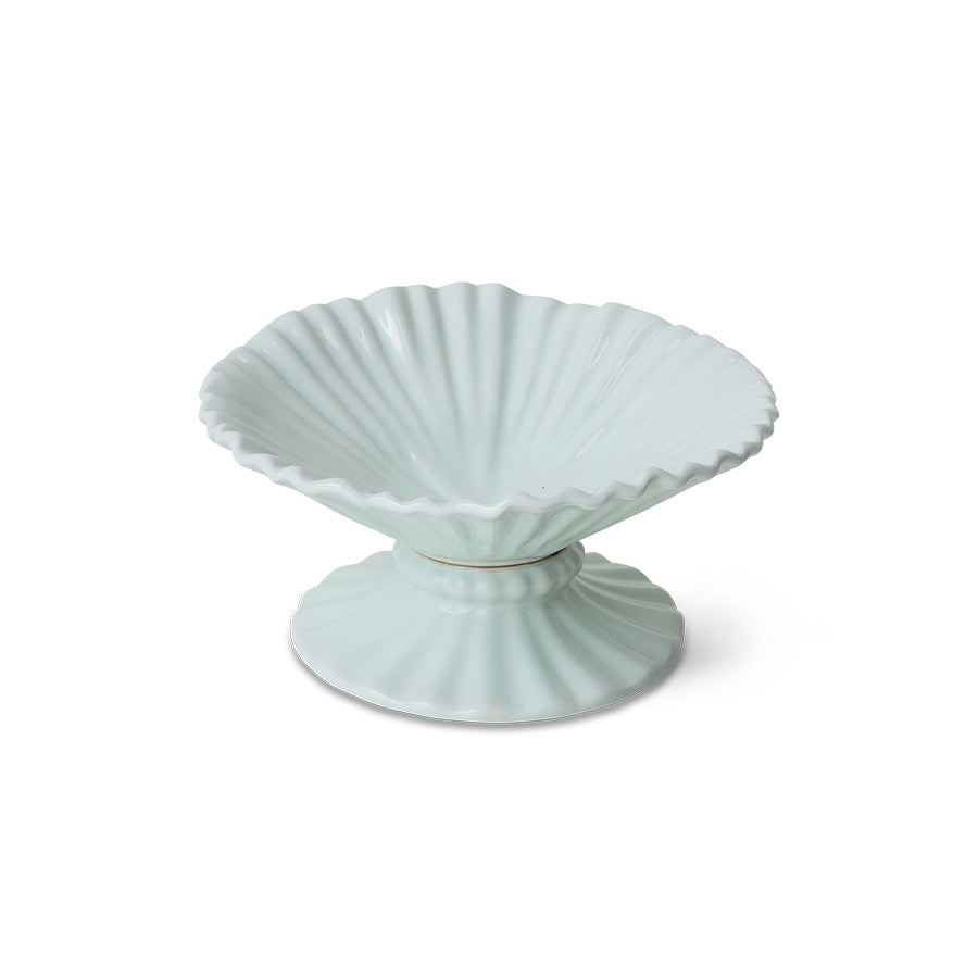 Light blue ceramic dish with shell design on a white background