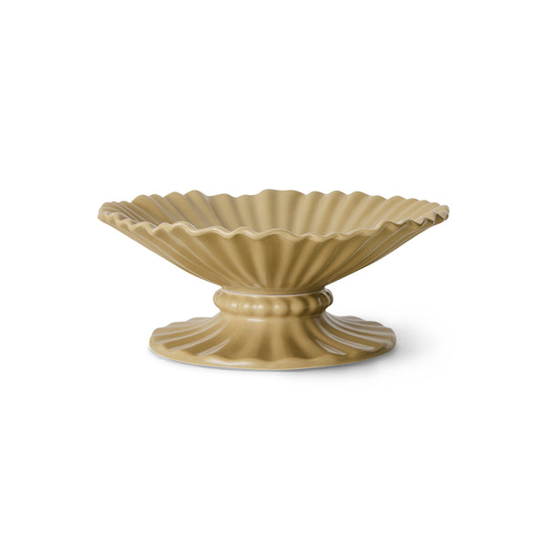 Beige ceramic bowl with decorative ribbed design on a white background