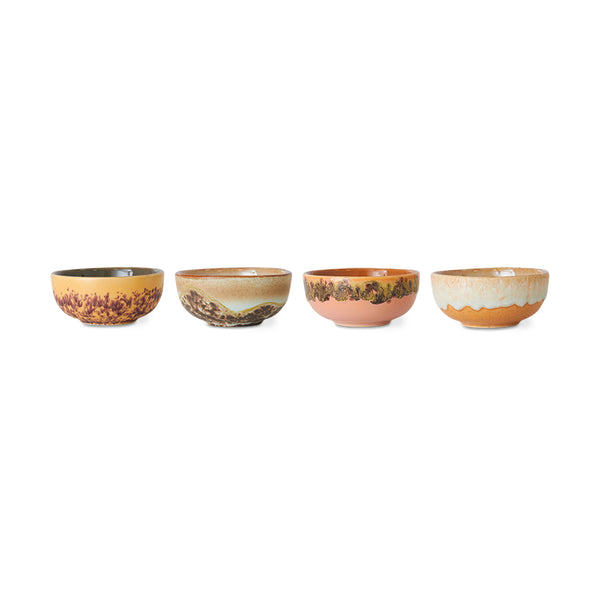 Set of four ceramic bowls with decorative patterns on a white background