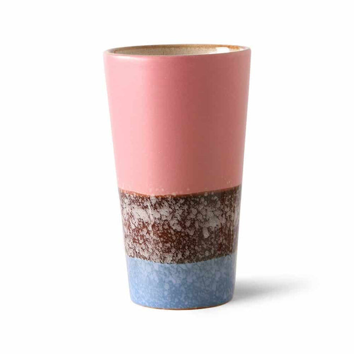 Multicolored ceramic tumbler with a gradient design on a white background