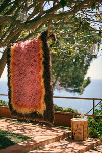 brown yellow orange and pink fluffy rug