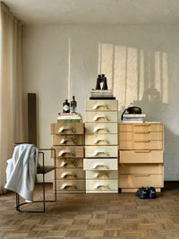 mocha colored chest of 6 drawers with cream colored cabinet and caramel draers