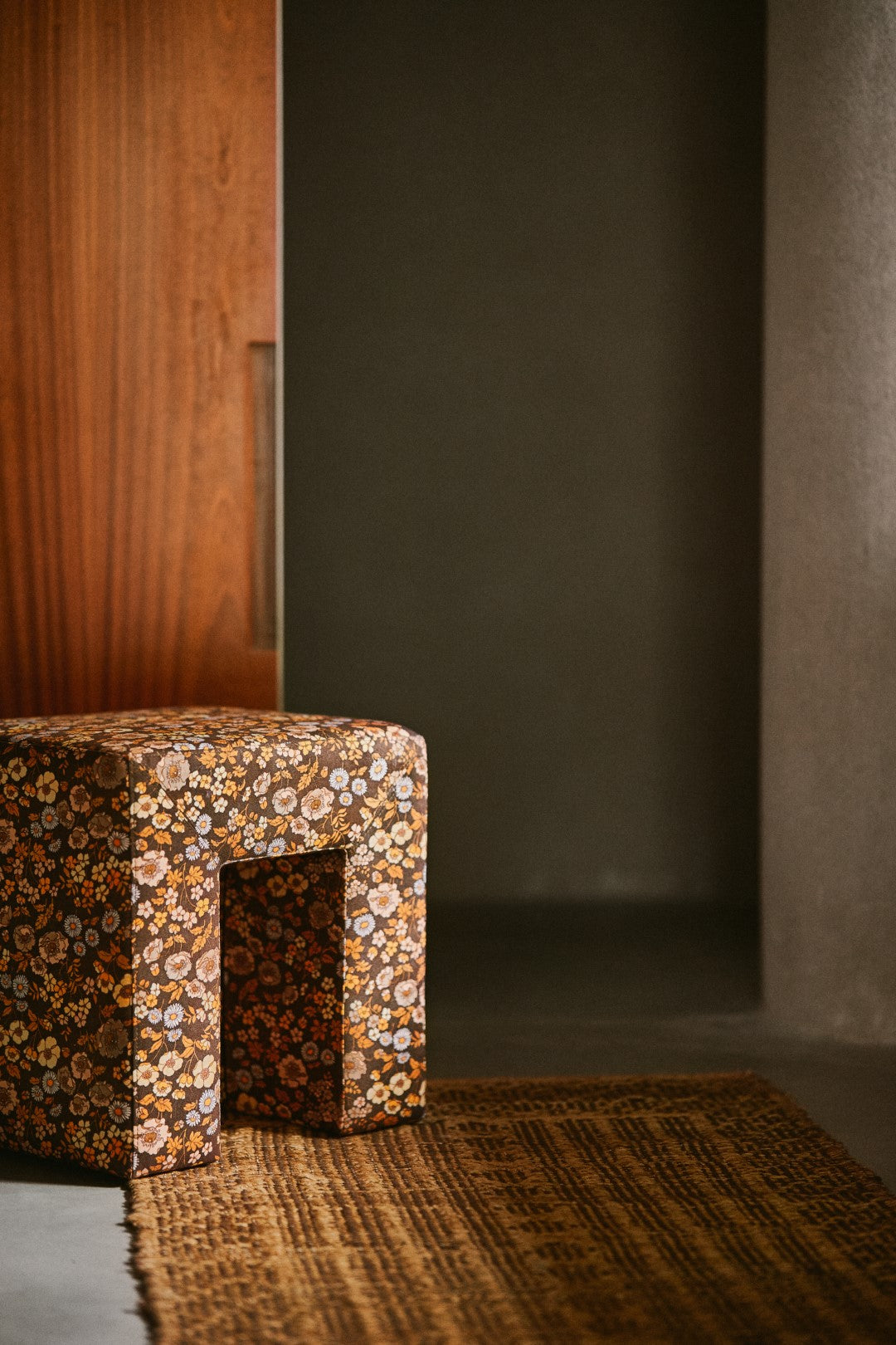 ottoman stool brown flower fabric in hallway