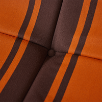 detail of brown and orange striped outdoor lounge chair