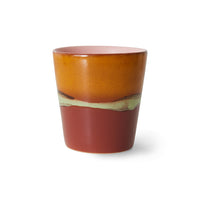 warm orange, pink, green and cherry colored stonware tumbler cup