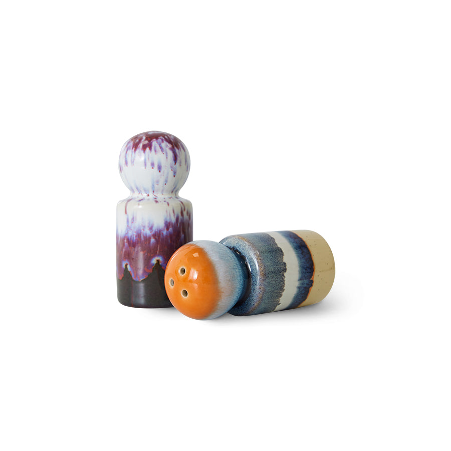 Colorful ceramic salt and pepper shakers on a white background