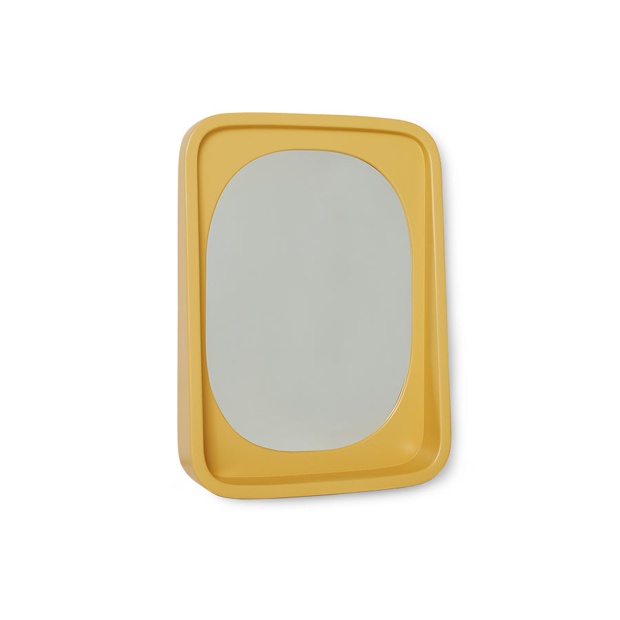 smooth surface ochre yellow mirror in frame with shelf