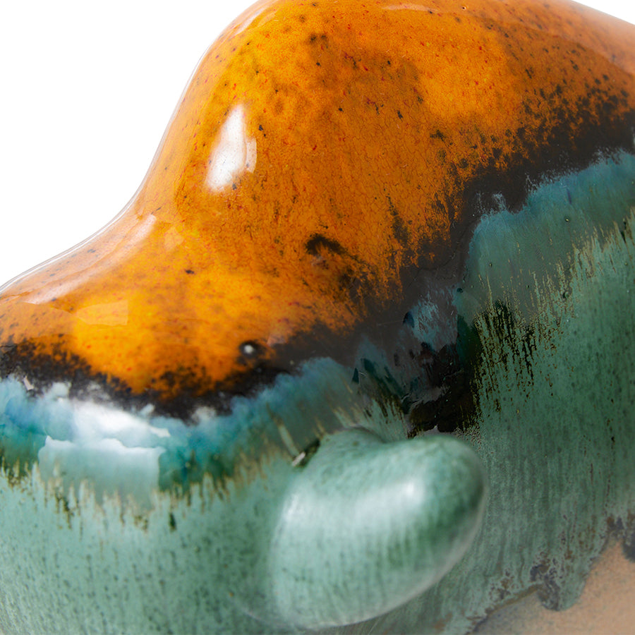 orange teal and green bull sculpture