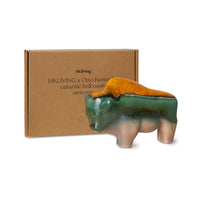 orange teal and green bull sculpture