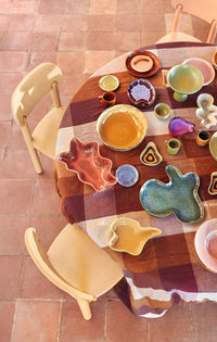 table filled with organic shaped bowls and platters