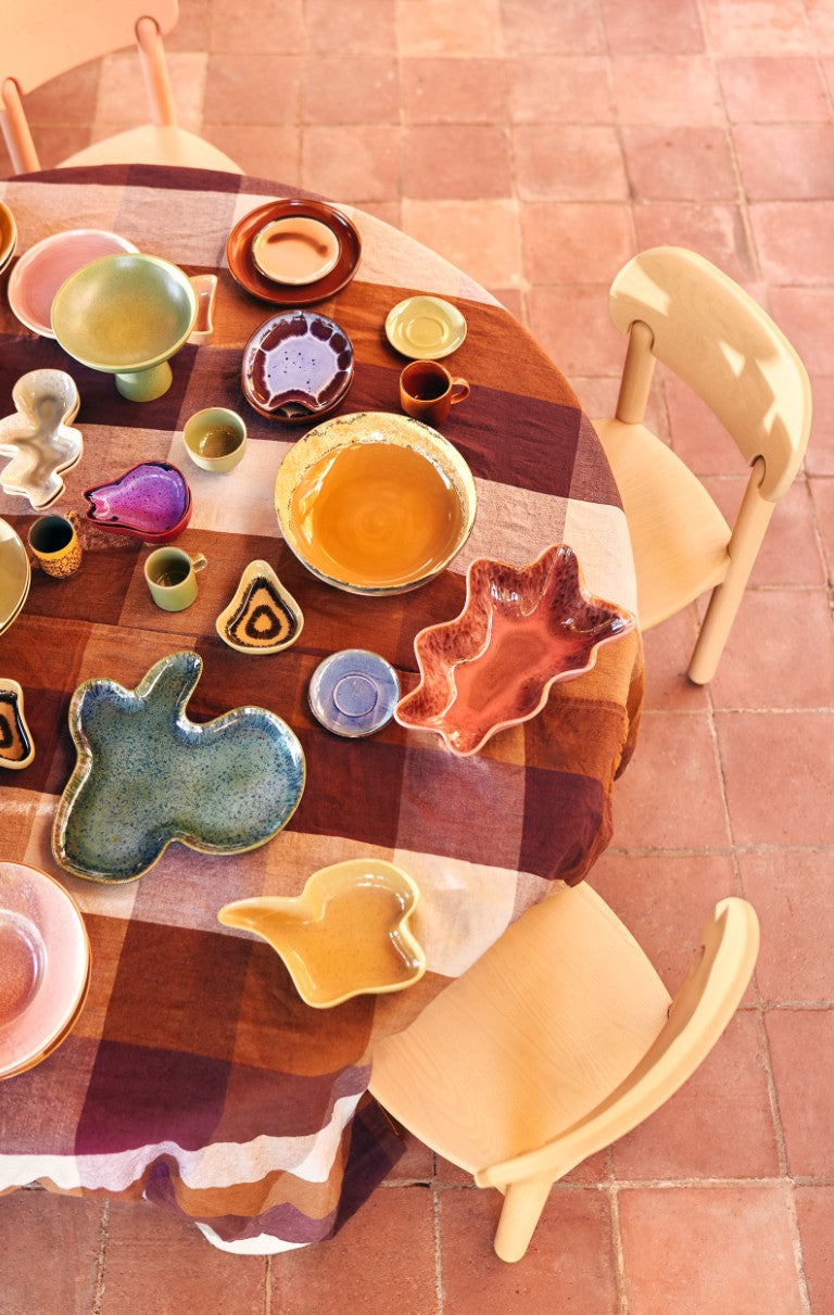 brown and blue organic shape ceramic plate on table