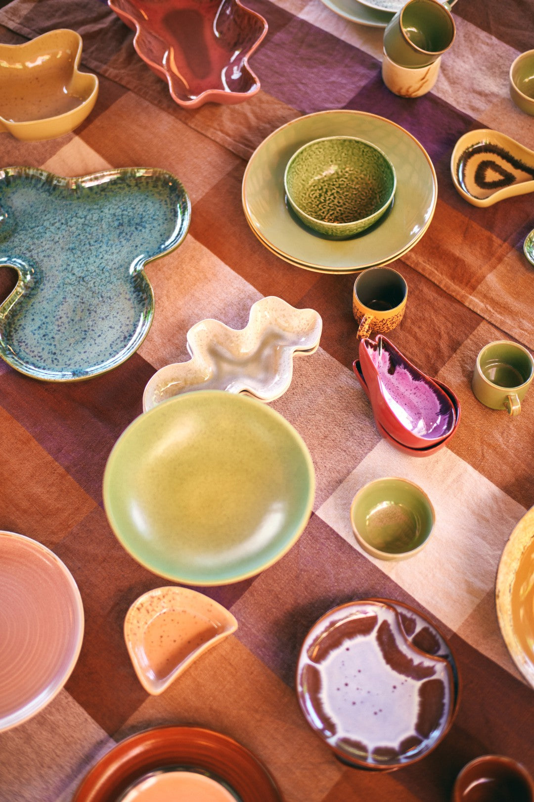 freeform style serving ware in green, blue pink red coral on table