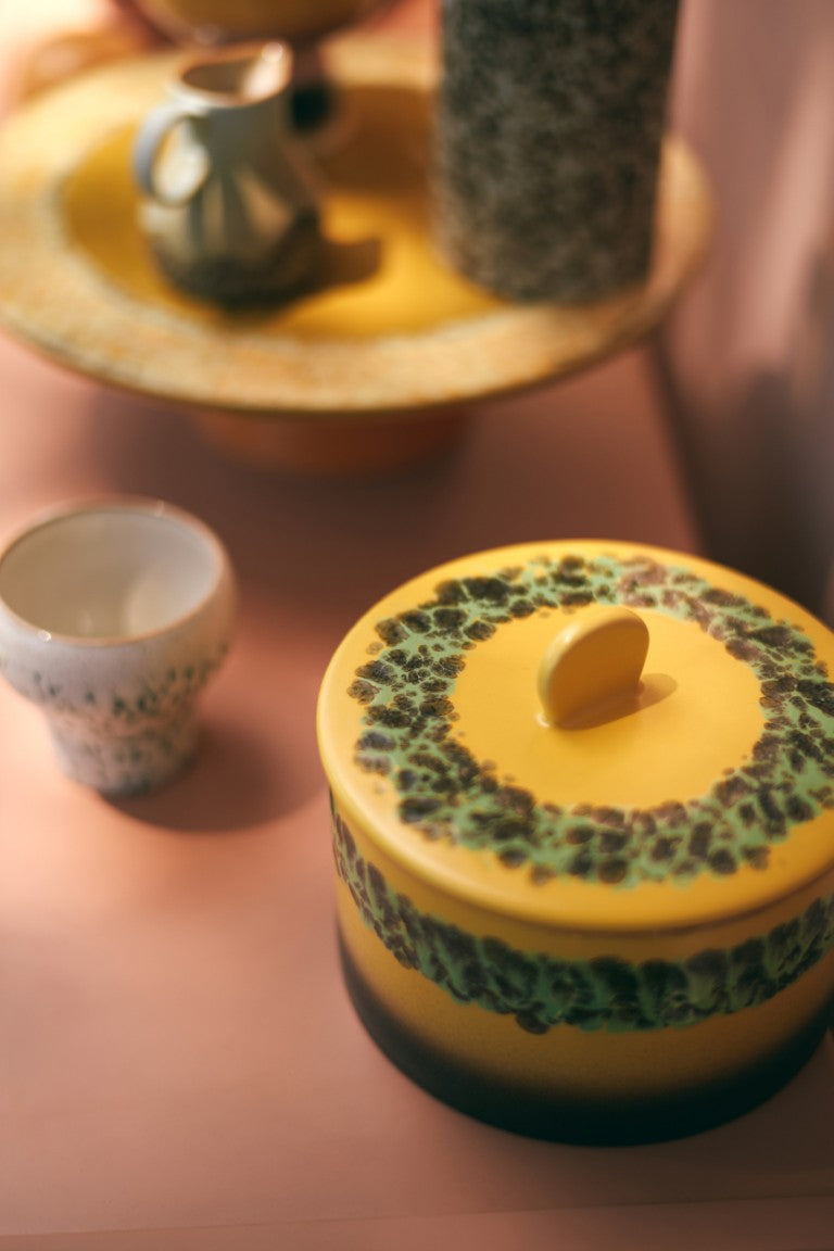 yellow brown and green stoneware cookie jar