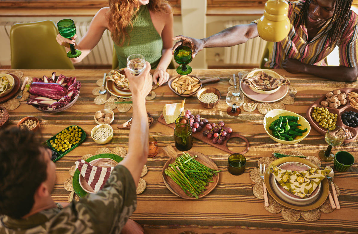 table filled with ceramic and wooden serving plates and boards