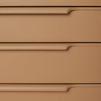 detail of wooden chest of drawers in camel color