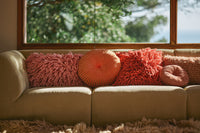  with rugged woolen pillows and round pillows