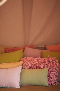 pillows in pink green and orange with texture and trim