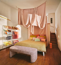 bedroom with different style pillows